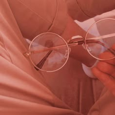 a person wearing glasses while sitting down