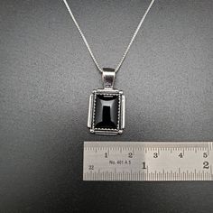 Visit our on-line shop at: Etsy.com/shop/AlbuquerqueDesigns *sterling silver necklace pendant *rectangle shape pendant with silver box chain necklace 18 inches long *southwestern jewelry *black onyx / black stone *calibrated pre-cut stones in millimeter and shape of stone: 14x10nn rectangle shape *back of jewelry items are all covered / do not show the back of stones *all jewelry items are made to ship, slight variations in stones will occur comparing to pictures. *size of a penny is 19mm or a d Formal Sterling Silver Necklace With Rectangular Pendant, Classic Sterling Silver Necklace With Rectangular Pendant, Minimalist Rectangular 925 Stamped Jewelry, Black Square Necklace For Gift, Silver Necklace With Rectangular Box Chain, Black Sterling Silver Jewelry With Rectangular Stone, Square Silver Sterling Silver Necklace, Silver Necklace With Rectangular Stone For Gift, Square Sterling Silver Necklace In Silver