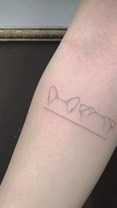 a person with a small tattoo on their arm