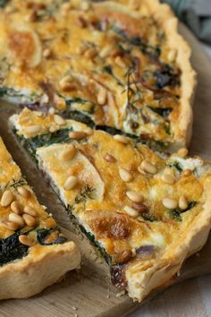 a quiche with spinach, pine nuts and cheese