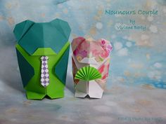 two origami style items sitting next to each other