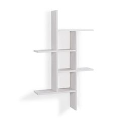 a white book shelf with three shelves on each side and one in the middle, against a