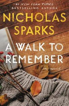 a book cover for a walk to remember by nicholas sparks with autumn leaves and an open book