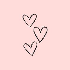 three hearts drawn in black on a pink background