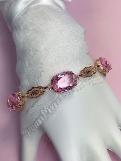 "Made To Order This is a brand new beautiful Edwardian/Art Deco reproduction solid sterling silver with rose gold plating filigree simulated pink topaz gemstone bracelet. The gemstones are approx. 15ctw (3 stones, 5 each) gemstones are 14mm by 10mm in L & W. The bracelet is 8.5 inches long at max, fits 7\" to 8.5\". Notice the beautiful floral craftsmanship of the filigree settings and links. A gift-box is included for safe shipping. Feel free to ask questions and thanks for looking at my li Topaz Bracelet, Bracelet Rose Gold, Edwardian Jewelry, Edwardian Art, Pink Topaz, Luxury Rings, Glass Rings, Green Peridot, Topaz Gemstone