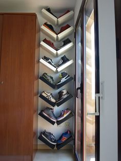 there is a shoe rack in the hallway