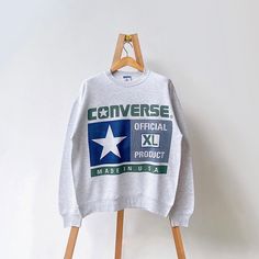 90s Converse all star made in USA crewneck sweatshirt/ L * PLEASE READ BEFORE PURCHASE * PLEASE consider the PHOTOS before making the decision * The images may DIFFER in appearance from the actual product because we took pictures under daylight.  * PLEASE send your PHONE NUMBER after your purchase for the shipping company to contact you X No returns X No refund Condition : 9/10 More details : look at the pictures  Brand : Converse Size on tag : L Pit to pit/ Chests : 24/48 inches  Length : 27.5 inches  Material : cotton polyester  Color : gray * ALL ITEMS are VINTAGE which may show some signs of wear and tear * Due to the different display and different light, the picture may not reflect the actual color of the item * Please, remember that our items are vintage so they may show some signs Retro Crew Sweatshirt For Streetwear, 90s Crew Sweatshirt With Logo Print, 90s Crew Sweatshirt, Throwback Crew Neck Sweatshirt With Logo Print, Throwback Crew Neck Sweatshirt For Streetwear, Throwback Oversized Crew Sweatshirt, Oversized Throwback Crew Sweatshirt, Oversized Crew Neck Throwback Sweatshirt, 90s Converse