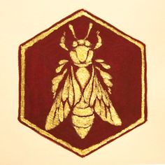 a drawing of a bee on a red and white hexagonal background with gold foil