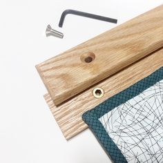 a piece of wood sitting on top of a table next to a pair of scissors