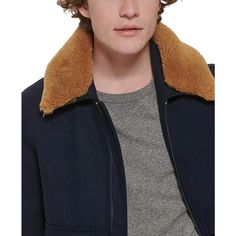 The luxuriously faux-fur trimmed bomber gets you trending. Snap up this Tommy Hilfiger essential with cozy rib-knit cuffs and hem for ultimate warmth and style no matter the season. Streamlined zip and dual snap pockets provide ample storage on-the-go. Crafted from soft, quality fabrics, you'll look as good as you feel layering this versatile piece. Don't just double tap, turn heads in this standout jacket sure to bring the likes. Tommy Hilfiger Man, Faux Fur Collar, Fur Collars, Fur Trim, Knit Cuff, Faux Fur, Rib Knit, Quality Fabric, Tommy Hilfiger