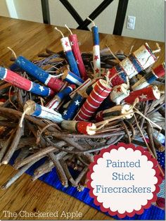 patriotic painted stick firecrackers on a table with the words painted stick firecrackers