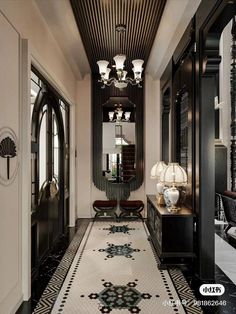 the hallway is decorated in black and white with chandeliers hanging from the ceiling