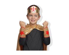 a young boy wearing a costume with gold and red stars on his chest, standing in front of a white background