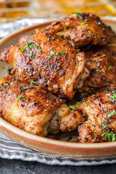 chicken wings in a bowl with parsley on top