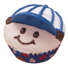 a blue and white cupcake with a smiling face