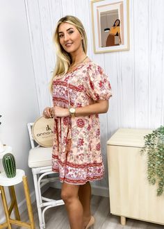 The Emes Shop dress is detailed with feminine puff sleeves. Features a floral print. tie neck detail. flowy skirt. and above knee length. Pair it with a sun hat and strappy sandals for a boho look.MATERIAL:100% ViscoseMEASUREMENTS: Product Length 35"-37.5"in 4-6-Small | Waist: 25"-26.5"in | Chest: 33"-34.5"in | Hips: 33.5"-35"in 6-8-Medium | Waist: 26.5"-28"in | Chest: 34.5"-36"in | Hips: 35"-36.5"in 8-10-Large | Waist: 28"-29.5"in | Chest: 36"-37.5"in | Hips: 36.5"-38"in 10-12-X-Large | Waist: Summer Boho Dress For Garden Party, Casual Summer Peasant Dress, Mini Length, Casual Summer Peasant Dress Mini Length, Casual Boho Dress With Boho Print For Spring, Flowy Boho Dress For Spring Garden Party, Casual Mini Length Peasant Dress For Summer, Casual Boho Dress For Garden Party, Spring Boho Print Sundress, Boho Print Sundress For Spring