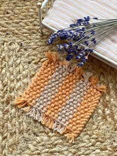 a crocheted placemat with lavenders on it next to an ironing board