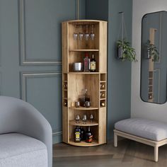 a corner cabinet with bottles and glasses on it in a living room next to a couch