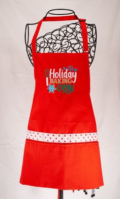 a red apron with the words holiday baking on it