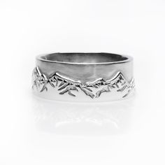 Find yourself at the peak both mentally and on the slopes with this 8mm wide Ridge Ring. The mountains call to you and you whistle a tune back. As you look down at the vast landscape below you, holding the sky within your fingertips, you're ready for your next momentous climb whether in the office or the snowy mountain top. The Ridge Ring comes in Sterling Silver, 14K White Gold, 14K Yellow Gold, or Platinum - a taste for all seasons. *All pieces are made to order* Snowy Mountain, Snowy Mountains, The Peak, Mountain Top, Wooden Jewelry, Stackable Rings, Sterling Ring, Band Rings, Sterling Silver Rings