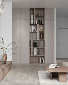 a living room filled with furniture and a book shelf