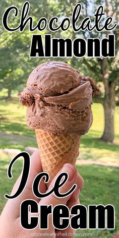 a hand holding an ice cream cone with chocolate on top and the words, chocolate almond ice cream