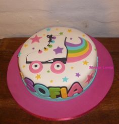 a birthday cake decorated with an image of a unicorn on it's face and stars