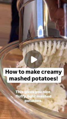 a person is using a mashed potato to make creamy mashed potatoes