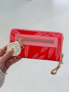 Expertly crafted from durable, high-quality white fabric, the Spartina 449 Wallet is the perfect accessory for any fashion-forward individual. Its sleek design and versatile color make it a must-have for both everyday use and special occasions. Upgrade your style game with Spartina 449. Removable wristlet/wallet strap Golden Spartina mermaid button & back exterior zipper coin pocket Wrap around zip closure Interior features: 14 card slots with RFID protective lining, 2 bills slots, ID window Roo Spartina 449, Wristlet Wallet, Chic Boutique, Holiday Specials, White Fabrics, Sleek Design, Special Events, Fashion Forward, Wallet