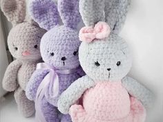 several crocheted stuffed animals sitting next to each other