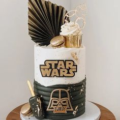 a star wars themed cake with gold decorations