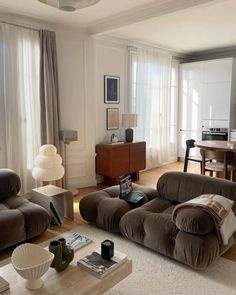 a living room filled with furniture and a flat screen tv