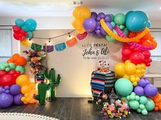 balloons and streamers decorate the entrance to a baby's first birthday party at willow, texas