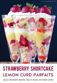 three desserts with strawberries and cream in glasses on a wooden table, ready to be eaten