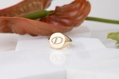 Discover the beauty of our 14K Gold Letter Ring, a stunning personalized signet ring perfect for showcasing your unique initial. Crafted with care, this custom initial jewelry adds a meaningful touch to any outfit.  - Material: 14K gold or sterling silver options - Size: Adjustable for a perfect fit - Customization: Choose your initials for a one-of-a-kind keepsake This elegant ring makes an ideal gift for her, celebrating individuality and cherished moments. Concerned about sizing? We offer guidance for the perfect fit. Plus, our eco-friendly practices ensure a sustainable choice for your jewelry collection. Don't wait--create a lasting memory with this exquisite ring today. Unique style and personal touch await! 📎How can you adjust the ring size? You can measure your ring size using eit Modern Personalized Initial Ring For Anniversary, Modern Monogram Signet Ring For Gift, Engraved White Gold Ring With Name, Modern Personalized Engraved Ring, Modern Personalized Engraved Round Ring, Fine Jewelry Personalized Initial Ring, Classic Initial Ring For Personalized Gift, Modern Oval Initial Ring Personalized, Personalized Rose Gold Sterling Silver Signet Ring