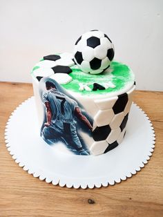 a soccer themed cake on a white plate