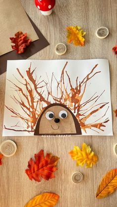 a paper plate with leaves on it and a drawing of a hedge