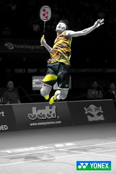 a man jumping in the air with a tennis racquet on a tennis court