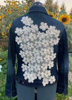 This is a medium sized soft denim jacket. The material is very comfortable and moves nicely. It has a lace overlay of flowers with some sequins. The contrast of the colors stands out beautifully! The flowers are also slightly ruffled giving it even more of a POP effect look! Fitted Lace Patchwork Outerwear For Spring, Fitted Lace Trim Outerwear For Spring, Fitted Outerwear With Lace Trim For Spring, Spring Fitted Outerwear With Lace Trim, Fitted Lace Outerwear For Spring, Spring Lace Patchwork Outerwear, Spring Outerwear With Lace Patchwork, Sparkly Jacket, Womens Jackets