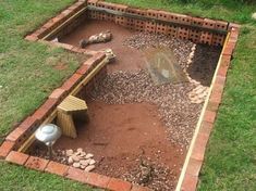 a garden area made out of bricks and gravel