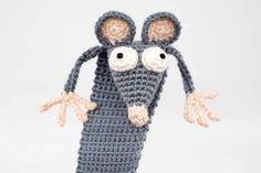 a crocheted mouse made out of yarn with two large eyes and one small nose