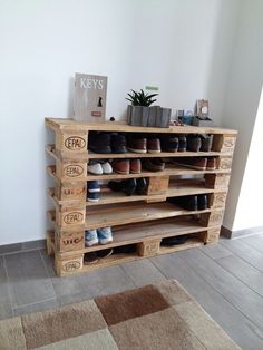 there is a wooden shelf with shoes on it