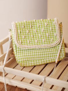 Are you a sling bag collector? Whether you are one or not, we bet you will become one after seeing this green sling bag as well as its simplicity and practicality. The checks' weaving, embellished beads and pearls make it a cutesy pick for a lunch date or a work meeting. Yep, it's THAT versatile. With one compartment and one pocket, this sling bag has been manufactured from printed jacquard fabric and lined with cotton on the inside. The metal fitting and the snap button add a polished look to t Trendy Green Woven Bag, Green Square Woven Bag, Green Woven Square Shoulder Bag, Green Woven Shoulder Bag, Green Woven Crossbody Shoulder Bag, Green Woven Pouch Bag, Green Sling Bag, Shoulder Sling Bag, Work Meeting