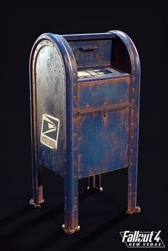 an old blue mailbox sitting on top of a black floor