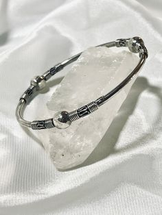 A Super Silver Bali Style Bangle Bracelet sitting on top of a crystal. Balinese Style, Bali Fashion, Balinese, Boho Vibe, Bangle Bracelet, Bangle Bracelets, Silver Bracelet, Bali, Bangles