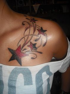 a woman with a star tattoo on her shoulder