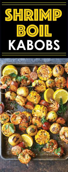 grilled shrimp and corn on the cob with lemons, parsley and herbs