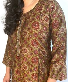 Beautiful, printed kurta and pant. It has prints along with gold print highlighting in a rayon silk material. Note:  Product color may have slight variations due to surrounding light. Festive Straight Kurta Palazzo Set With Printed Motifs, Silk Kurta With Printed Motifs For Diwali, Silk Kurta With Printed Motifs, Silk Kurta Tunic With Printed Motifs, Semi-stitched Bandhani Print Salwar Kameez, Traditional Summer Anarkali Set With Printed Motifs, Gold Anarkali With Printed Motifs, Festive Gold Traditional Wear With Printed Motifs, Traditional Silk Palazzo Set With Block Print