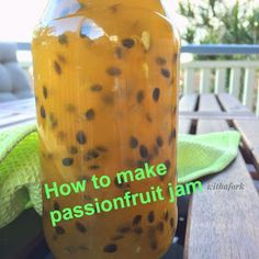 a jar filled with liquid sitting on top of a wooden table