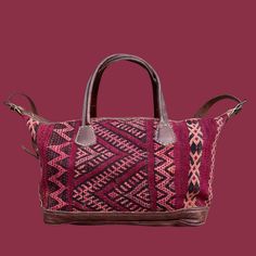 You're going to want to plan a weekend trip just so you can use this beautiful bag! Intertwined's beautifully crafted travel bag is handmade in Morocco from locally tanned leather and vintage, handwoven kilim. Each kilim is one-of-a-kind and handwoven with unique colors and patterns based on the region where it is made. Traditional Brown Travel Bag With Leather Handles, Traditional Brown Rectangular Weekender Bag, Traditional Brown Weekender Bag With Leather Handles, Traditional Travel Bags With Leather Handles, Traditional Tote Weekender Bag For Travel, Traditional Travel Satchel With Leather Handles, Traditional Tote Travel Bag With Leather Handles, Traditional Travel Tote Bag With Leather Handles, Artisan Handwoven Travel Satchel